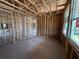 A spacious living room with exposed framing, creating an open and airy feel at 30124 Misty Pines Road, Mount Dora, FL 32757