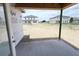 Covered patio with concrete flooring, offering a seamless transition to outdoor living space at 30124 Misty Pines Road, Mount Dora, FL 32757