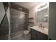Updated bathroom with a glass-enclosed shower, floating shelves, and a modern vanity at 3149 Quail Dr, Deltona, FL 32738