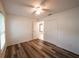 Bedroom featuring wood floors, a ceiling fan, and closet space at 3149 Quail Dr, Deltona, FL 32738
