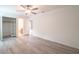 A bright bedroom featuring neutral colors, plank flooring, a ceiling fan, and a closet at 3149 Quail Dr, Deltona, FL 32738