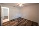 Bedroom features a ceiling fan, wood floors, and closet space at 3149 Quail Dr, Deltona, FL 32738