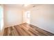 Bright bedroom with wood-look floors, ceiling fan, and a closet at 3149 Quail Dr, Deltona, FL 32738