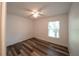 Bedroom featuring wood floors, a ceiling fan, and a window at 3149 Quail Dr, Deltona, FL 32738
