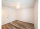 Simple bedroom with wood-look floors, closet, and natural light at 3149 Quail Dr, Deltona, FL 32738