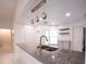Kitchen island featuring granite counters, stainless steel sink, and pendant lighting at 3149 Quail Dr, Deltona, FL 32738