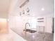 Updated kitchen featuring granite countertops and decorative hanging lighting fixtures at 3149 Quail Dr, Deltona, FL 32738