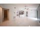 Spacious living area with white tile floors, a ceiling fan, and an open floor plan at 3149 Quail Dr, Deltona, FL 32738