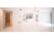 Open concept living room with tile flooring and a view to the kitchen at 3149 Quail Dr, Deltona, FL 32738