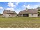 Spacious backyard view featuring a well-maintained lawn and large home with ample outdoor space for activities at 3201 Oaklea Dr, Deland, FL 32720