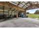 Inside the barn featuring an open layout with high ceilings, ample space, and natural light at 3201 Oaklea Dr, Deland, FL 32720