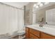 Bathroom featuring a shower and tub combo with neutral colors and floral decor at 3201 Oaklea Dr, Deland, FL 32720