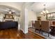 Open concept dining and living room featuring hardwood floors, fireplace and large dining table at 3201 Oaklea Dr, Deland, FL 32720