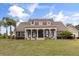Stunning single story home featuring large front yard and inviting front porch and meticulous landscaping at 3201 Oaklea Dr, Deland, FL 32720