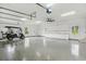 A large garage with epoxy floors, plenty of storage and space for vehicles or hobbies at 3201 Oaklea Dr, Deland, FL 32720