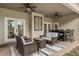 Covered outdoor patio with wicker furniture, ceiling fans, and a dining table, perfect for outdoor dining at 3201 Oaklea Dr, Deland, FL 32720