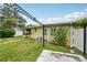 Well-maintained backyard featuring lush green grass, beautiful landscaping, and a charming dog house at 3312 Se 6Th St, Ocala, FL 34471