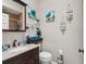 Charming bathroom with a granite vanity, decorative accents, and ample counter space; stylish and functional at 3312 Se 6Th St, Ocala, FL 34471
