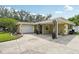 Side view of home featuring a garage and fountain at 3312 Se 6Th St, Ocala, FL 34471