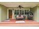 Welcoming front porch with comfortable seating, hanging chair, and decorative touches at 3312 Se 6Th St, Ocala, FL 34471