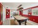 Vibrant game room with a pool table and attached recreation area; perfect for entertaining and relaxation at 3312 Se 6Th St, Ocala, FL 34471