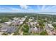 Wide aerial view showcasing landscape with distant lake and cityscape at 405 Courtlea Park Dr, Winter Garden, FL 34787