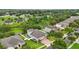 Aerial view capturing a charming home with a brick driveway and green landscape at 405 Courtlea Park Dr, Winter Garden, FL 34787