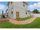 Beautiful backyard view featuring a brick walkway and well-maintained lawn at 405 Courtlea Park Dr, Winter Garden, FL 34787