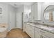 Bright bathroom with granite countertops, double sinks, and a soaking tub at 405 Courtlea Park Dr, Winter Garden, FL 34787