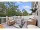 Relaxing deck area includes comfortable chairs, a fire pit, and outdoor furniture at 405 Courtlea Park Dr, Winter Garden, FL 34787