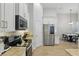 Kitchen with stainless appliances, light countertops, an eat-in dining area, and plenty of cabinet space at 405 Courtlea Park Dr, Winter Garden, FL 34787
