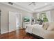 Spacious main bedroom with hardwood floors, a treadmill, and a stylish decor at 405 Courtlea Park Dr, Winter Garden, FL 34787
