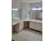 Spacious bathroom featuring a large vanity with double sinks and tile flooring at 4371 Aqua Vista Dr # G, Orlando, FL 32839