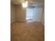 This bedroom features neutral walls, carpet, a ceiling fan, and natural light from a window at 4371 Aqua Vista Dr # G, Orlando, FL 32839