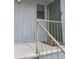 Entryway with a weathered green door and matching railing, creating a vintage exterior at 4371 Aqua Vista Dr # G, Orlando, FL 32839