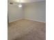 Inviting living area featuring neutral walls, carpet, and a classic light fixture at 4371 Aqua Vista Dr # G, Orlando, FL 32839