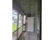 A screened patio features a door and railings overlooking the yard at 4371 Aqua Vista Dr # G, Orlando, FL 32839