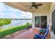 Relaxing back porch with seating overlooking a tranquil lake, perfect for enjoying serene views at 4642 Waterside Pointe Cir, Orlando, FL 32829