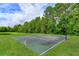 Outdoor basketball court for residents to enjoy, framed by lush greenery at 4642 Waterside Pointe Cir, Orlando, FL 32829