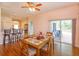 Open floor plan with dining area and sliding door to exterior patio at 4642 Waterside Pointe Cir, Orlando, FL 32829