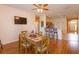 Open floor plan with dining area and kitchen bar seating at 4642 Waterside Pointe Cir, Orlando, FL 32829