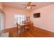 Comfortable dining room with view of the lake and a ceiling fan at 4642 Waterside Pointe Cir, Orlando, FL 32829