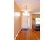 Inviting foyer with hardwood floors, a pendant light, and view into the adjacent living space at 4642 Waterside Pointe Cir, Orlando, FL 32829