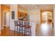 Kitchen area with breakfast bar and three bar stools, stainless steel appliances, and wood cabinets at 4642 Waterside Pointe Cir, Orlando, FL 32829