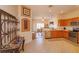 Open concept kitchen with wood cabinetry, stainless appliances, and eat-in dining at 4642 Waterside Pointe Cir, Orlando, FL 32829