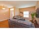 Bright living space with hardwood flooring, neutral walls, and comfortable seating arrangement at 4642 Waterside Pointe Cir, Orlando, FL 32829