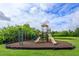 Well-maintained community playground with multiple slides and climbing structures in a verdant green surrounding at 4642 Waterside Pointe Cir, Orlando, FL 32829