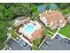 Aerial view of a pool and hot tub with surrounding palm trees at 620 Glenwood Ct # 79, Altamonte Springs, FL 32714
