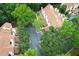 Aerial view of townhouses with mature trees and parking at 620 Glenwood Ct # 79, Altamonte Springs, FL 32714