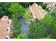 Aerial view of townhouses with mature trees and parking at 620 Glenwood Ct # 79, Altamonte Springs, FL 32714